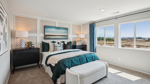 Spacious primary bedroom with king bed