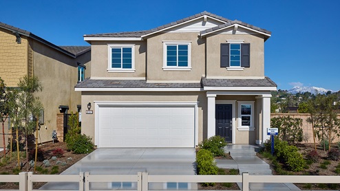 Two-story Bungalow home with shutters and two-car garage
