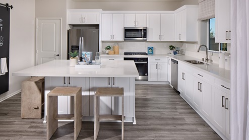 Kitchen with white cabinets and stainless steel appliances