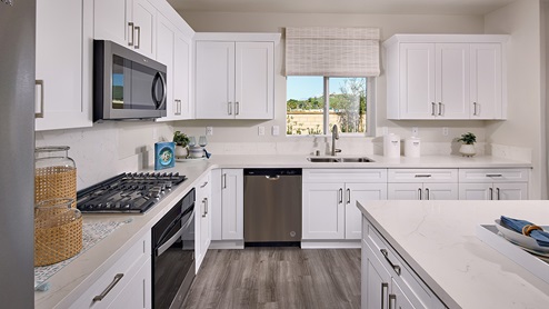 Kitchen with white cabinets and stainless steel appliances