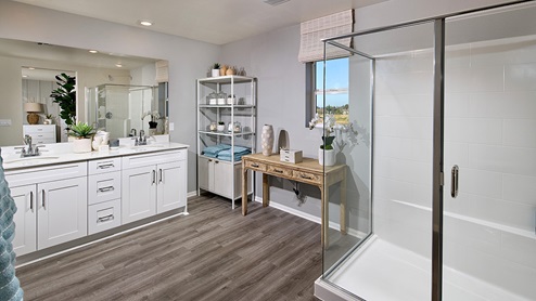 Primary bathroom with walk in shower and double sinks
