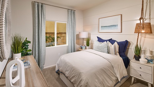 Bedroom with plush carpet and full bed