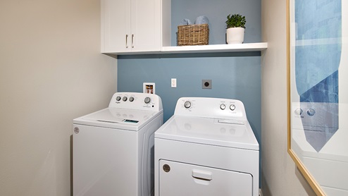 Laundry room with upper shelf, and cabinet