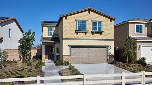Two-story Craftsman model home with two-car garage and shutters