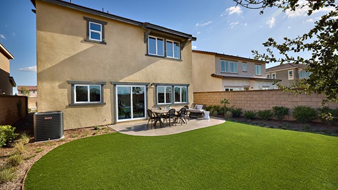 Spacious backyard with patio area and turf