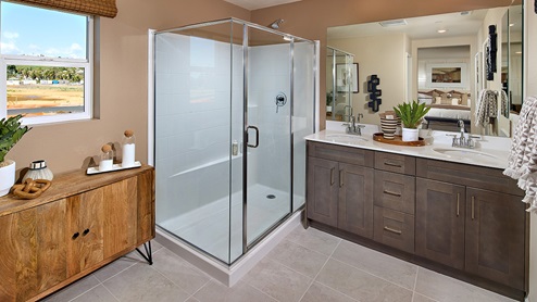 Primary bathroom with walk in shower and double sinks