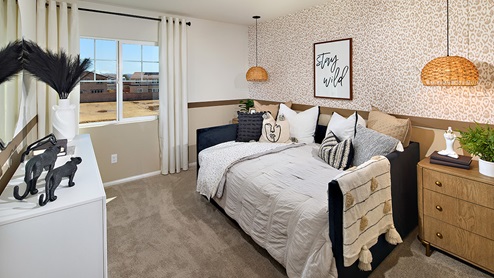 Fully furnished bedroom with full bed