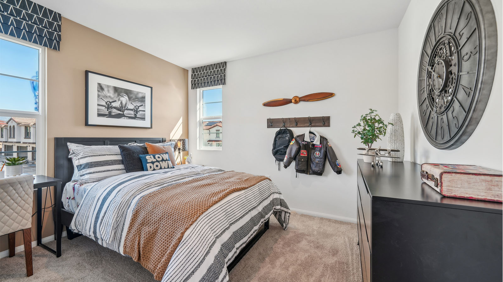 Bedroom with twin bed and plush carpet