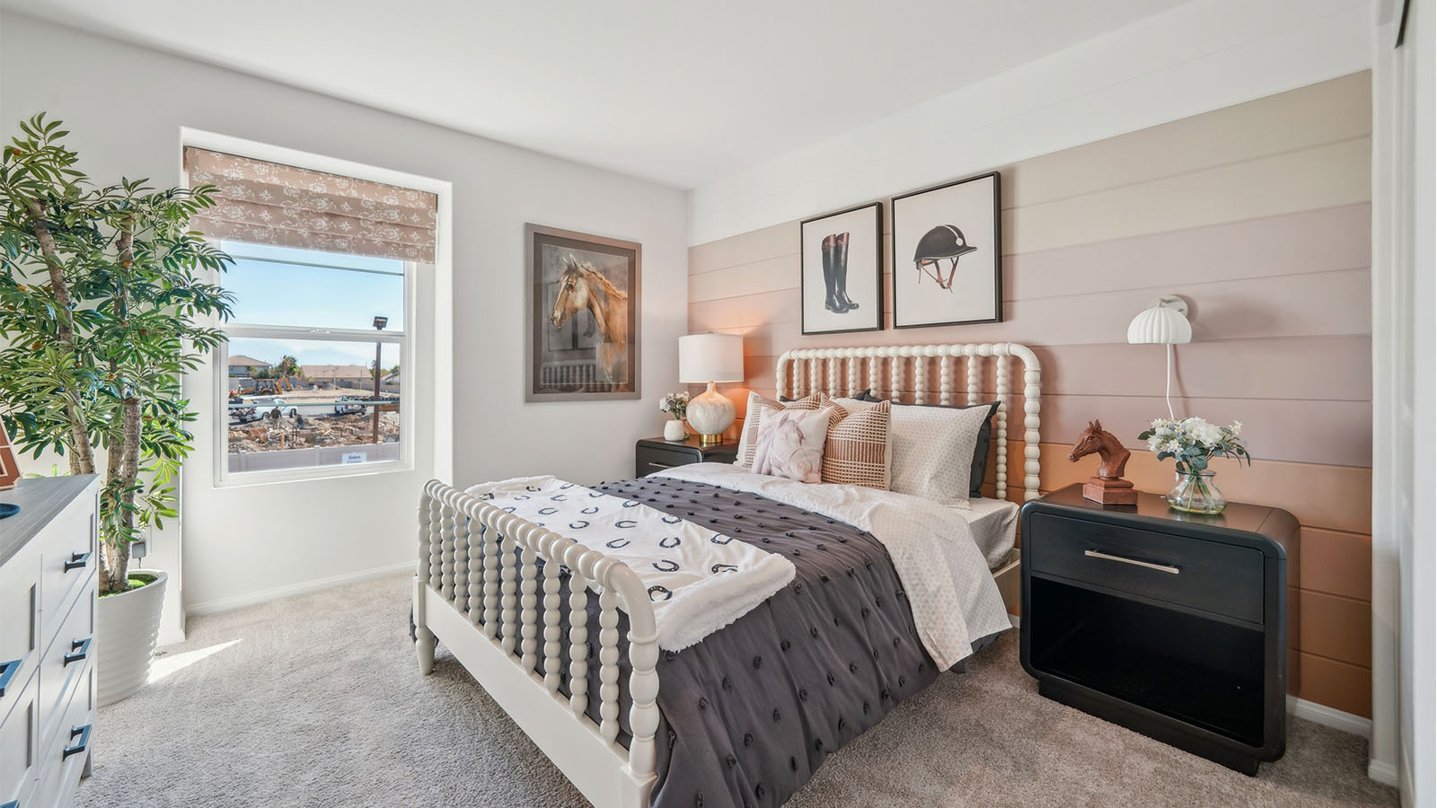 Bedroom with accent wall, full size bed, and plush carpet