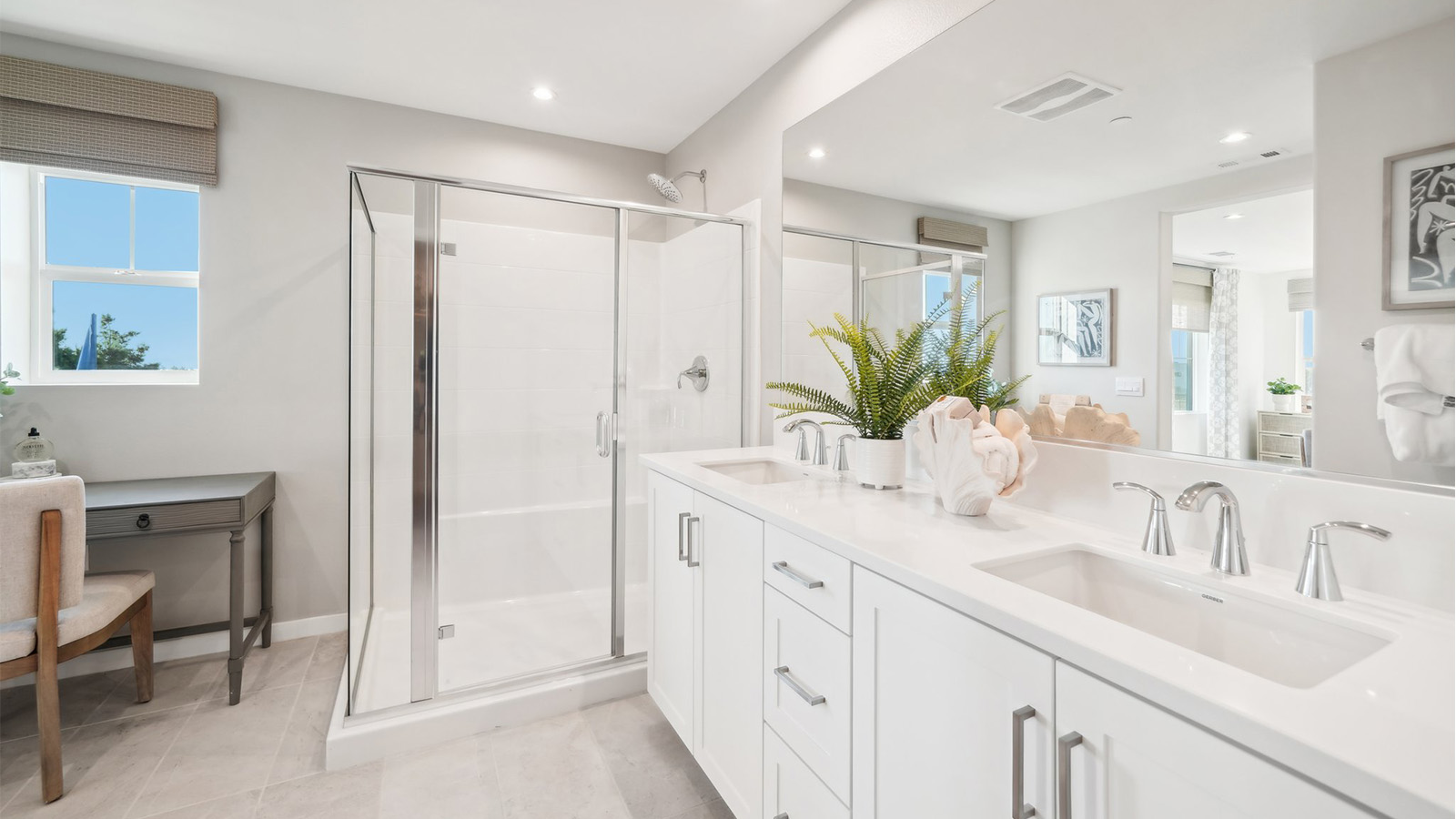 Primary bathroom with walk in shower and double sinks