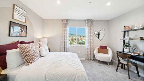 Spacious bedroom with full size bed, desk and chair