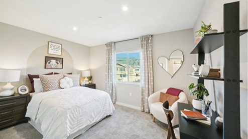 Spacious bedroom with full size bed, desk and chair