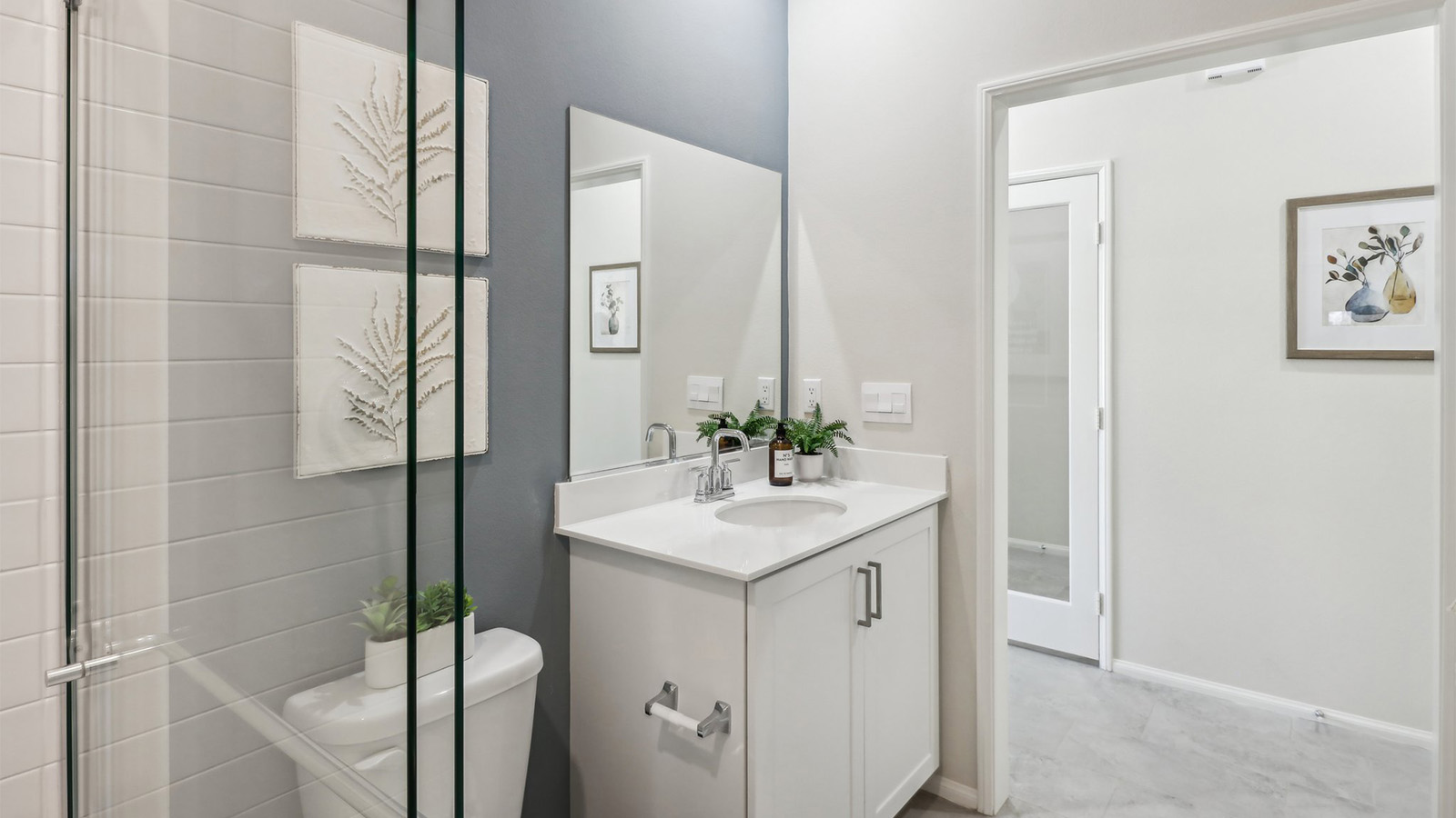 Secondary bathroom with vanity and shower
