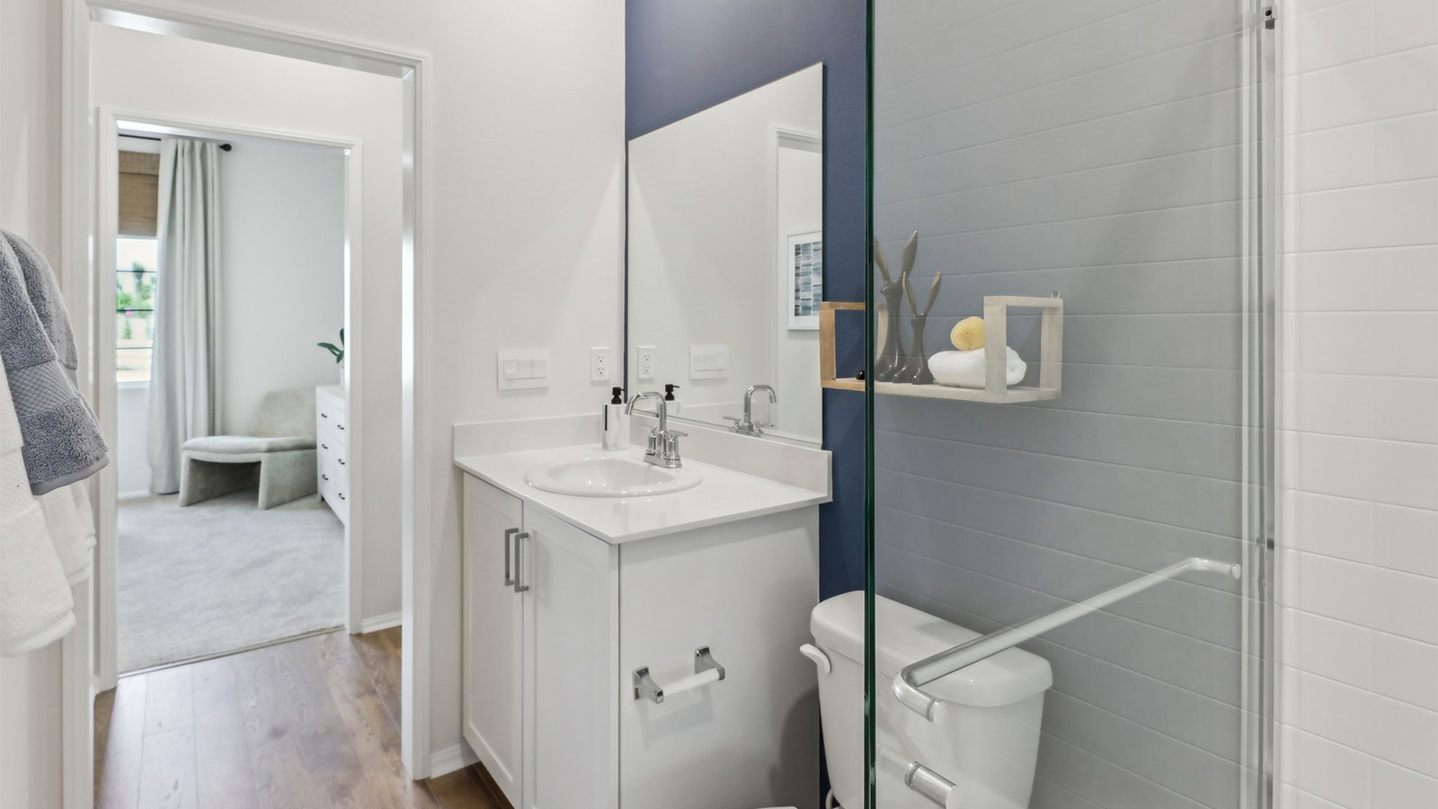 Secondary bathroom with vanity and shower