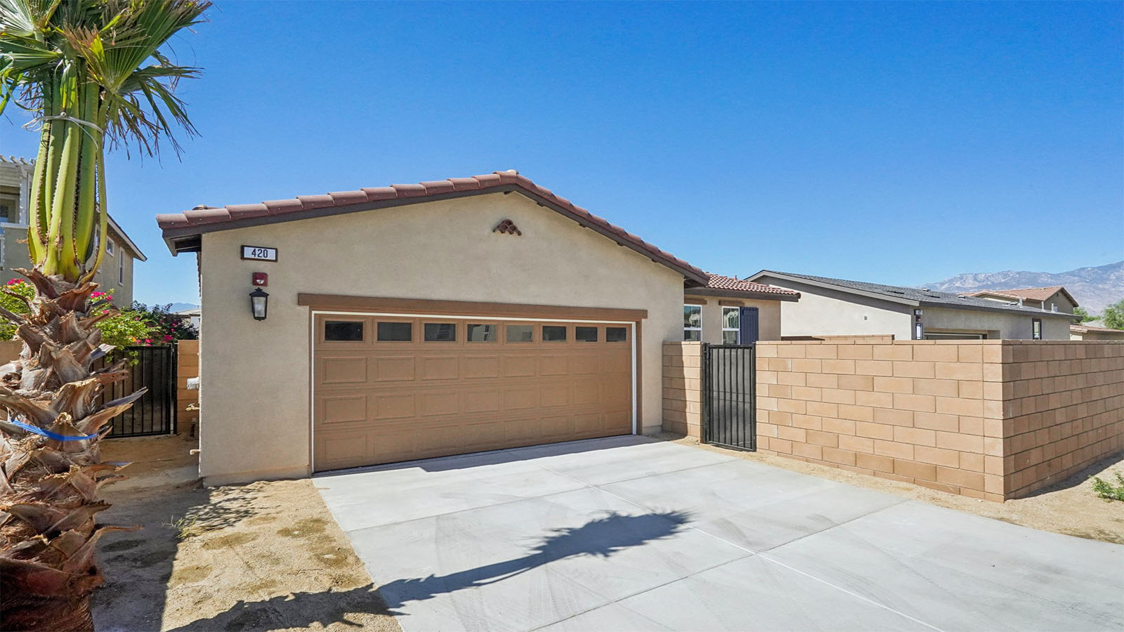 Single story home with garage with windows