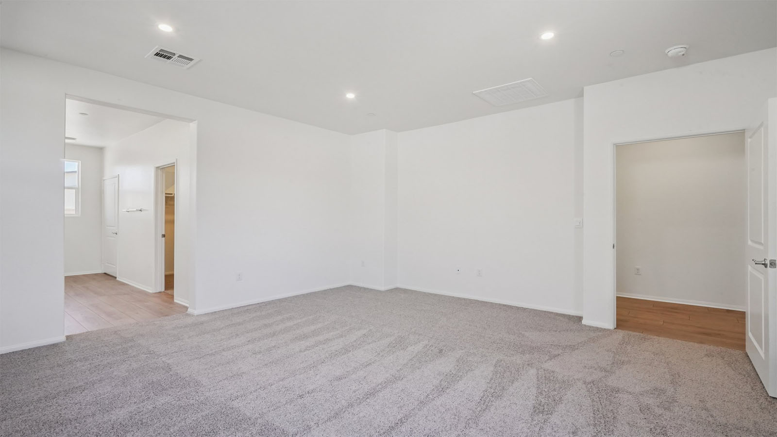 Primary bedroom with carpet