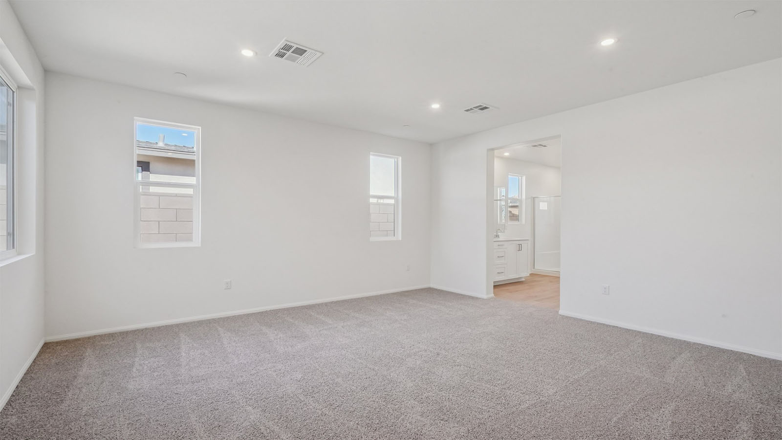 Primary bedroom with carpet