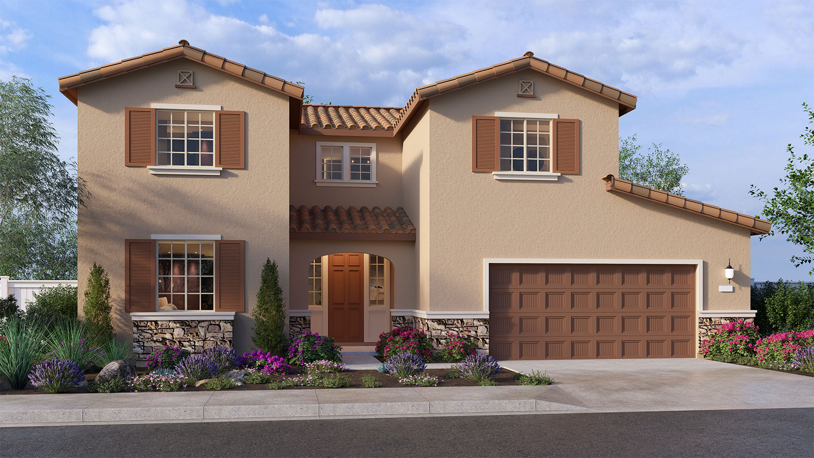 Two-story Tuscan home with stone veneer and two car garage