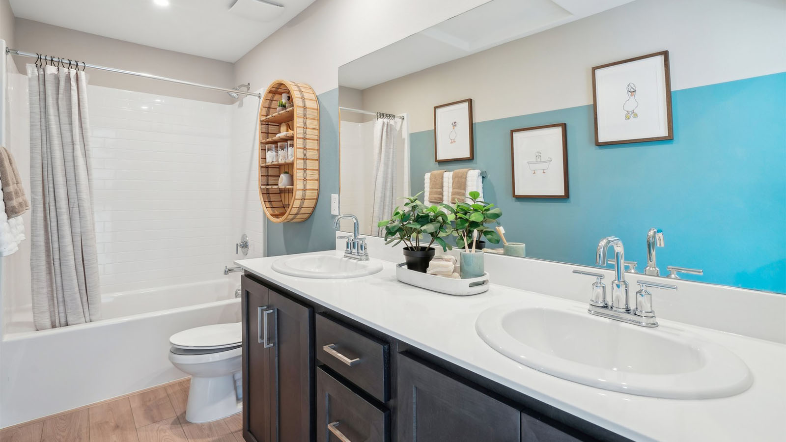 Secondary bathroom with vanity and tub shower combination