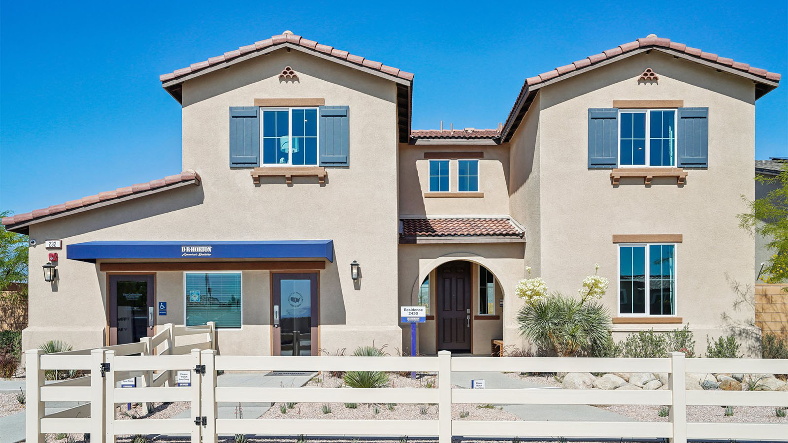 Two-story Spanish home with Two-car garage with windows