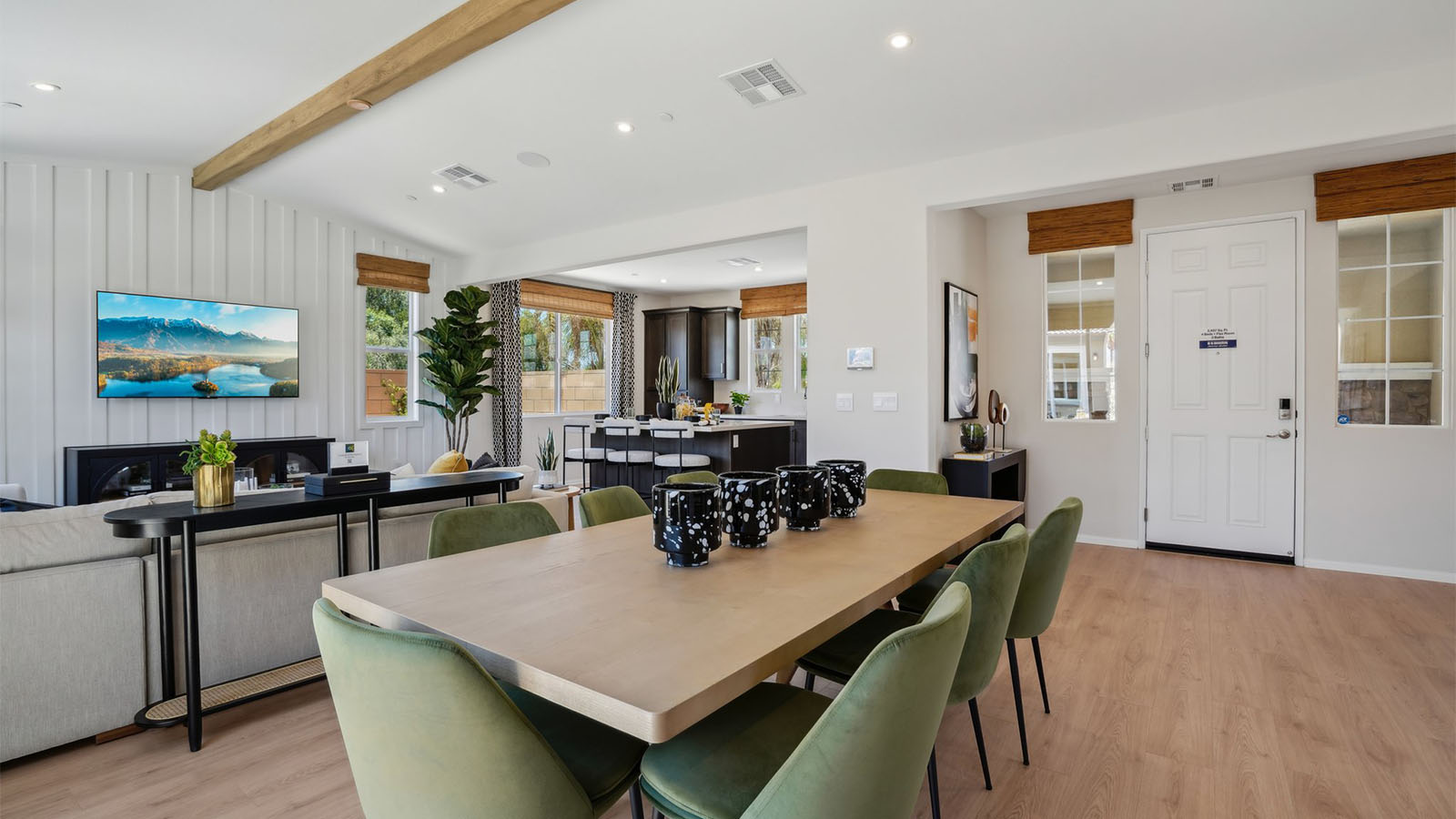Spacious open-concept great room, dining room and kitchen with vaulted ceiling