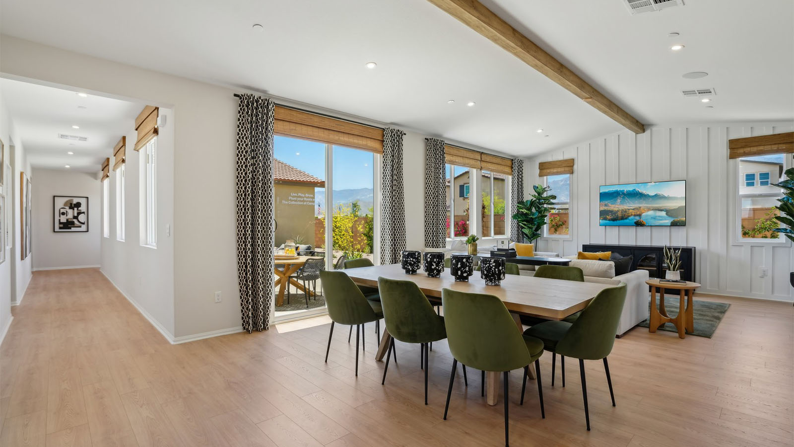 Spacious open-concept great room, dining room and kitchen with vaulted ceiling