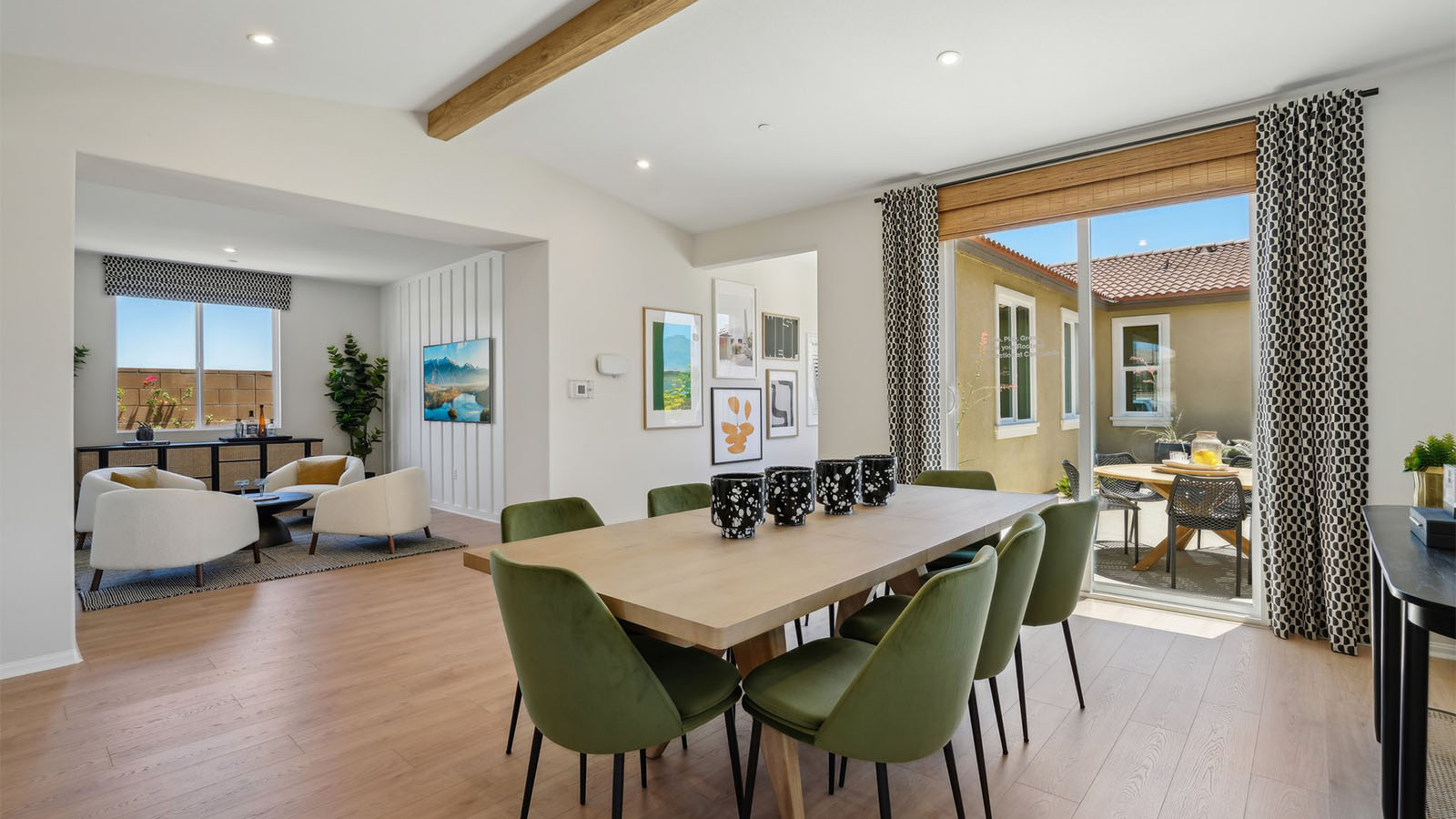 Spacious open-concept great room, dining room and kitchen with vaulted ceiling