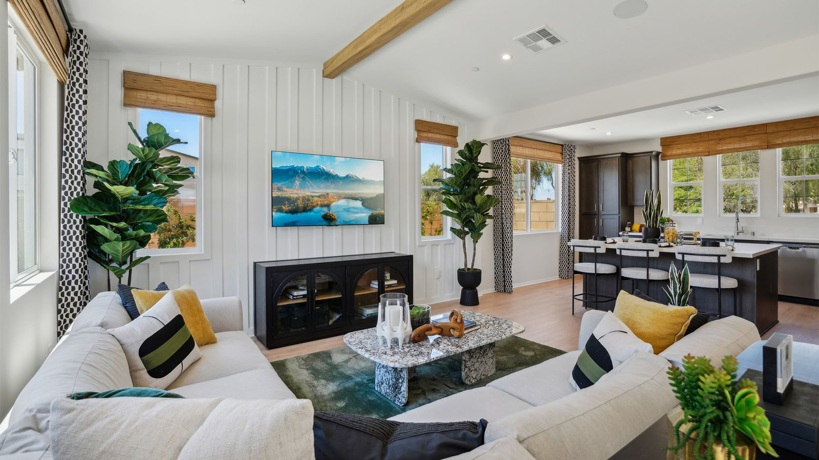 Spacious open-concept great room, dining room and kitchen with vaulted ceiling