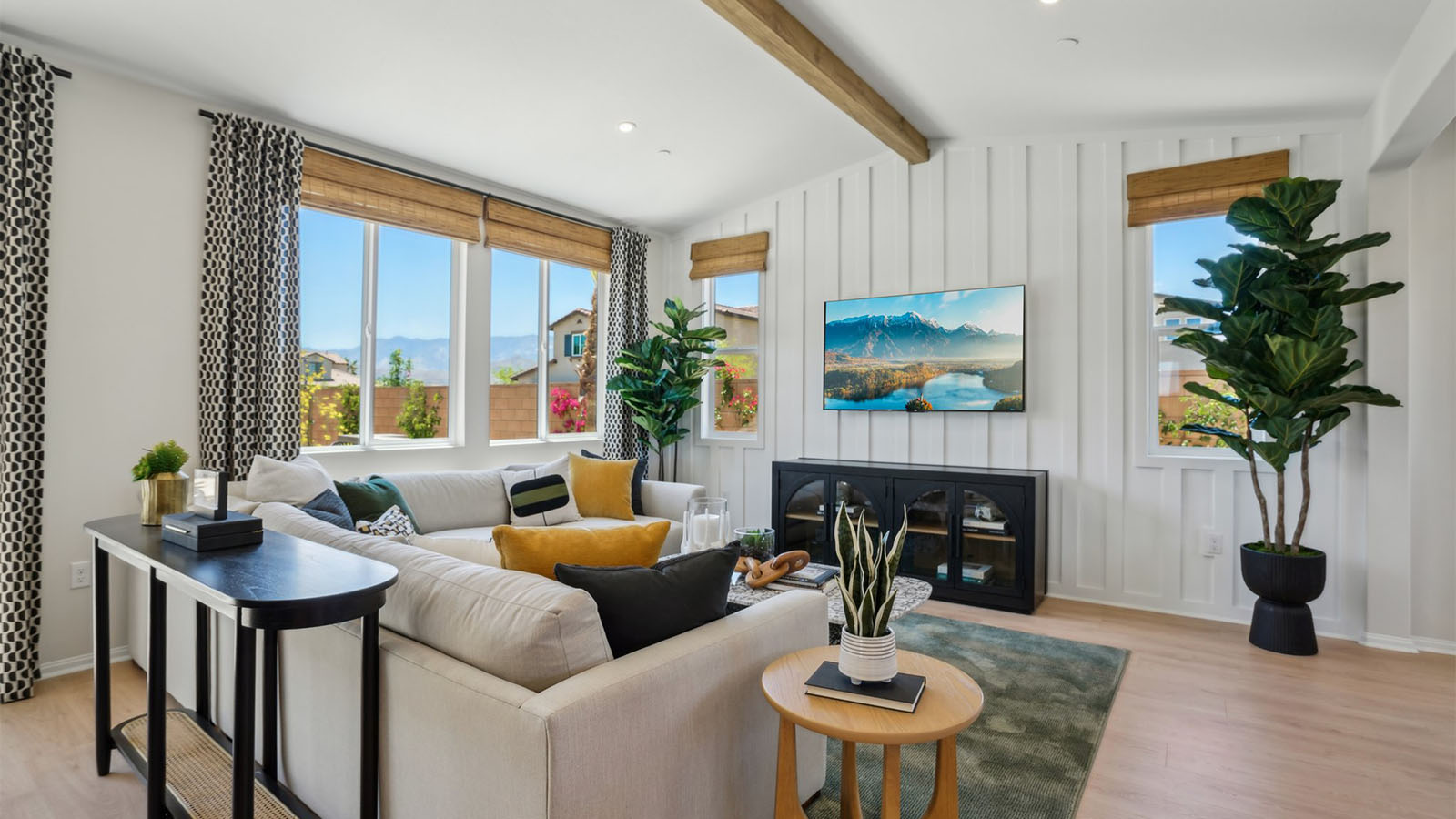 Spacious open-concept great room, dining room and kitchen with vaulted ceiling