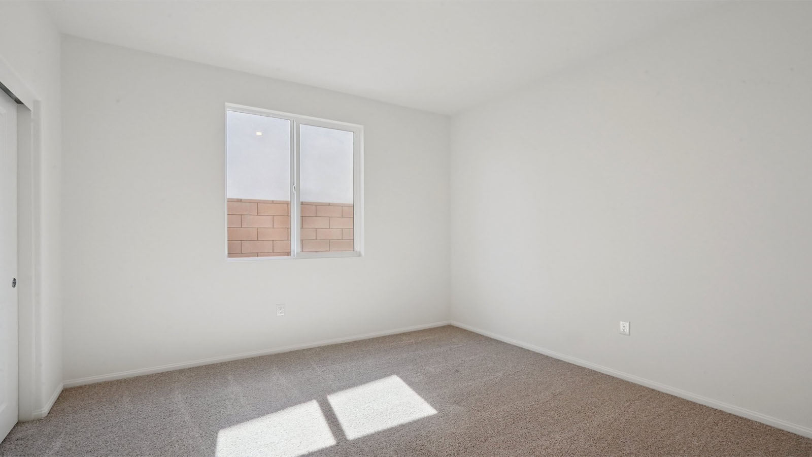 Secondary bedroom with carpet