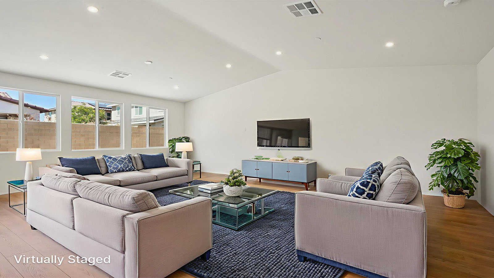 Spacious open-concept great room with vaulted ceiling