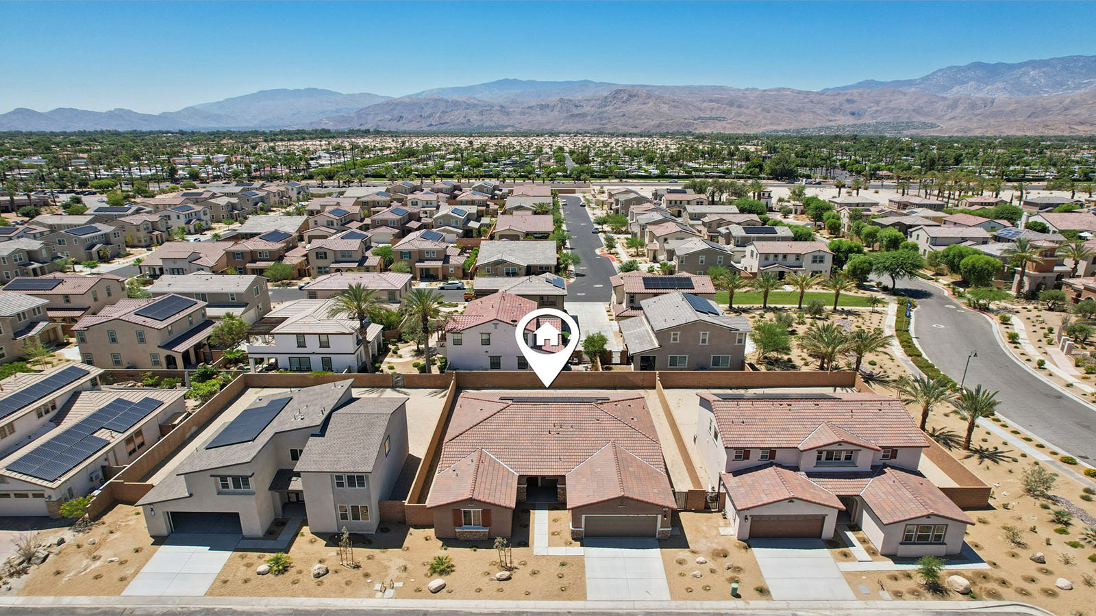 Aerial view of home with solar panels