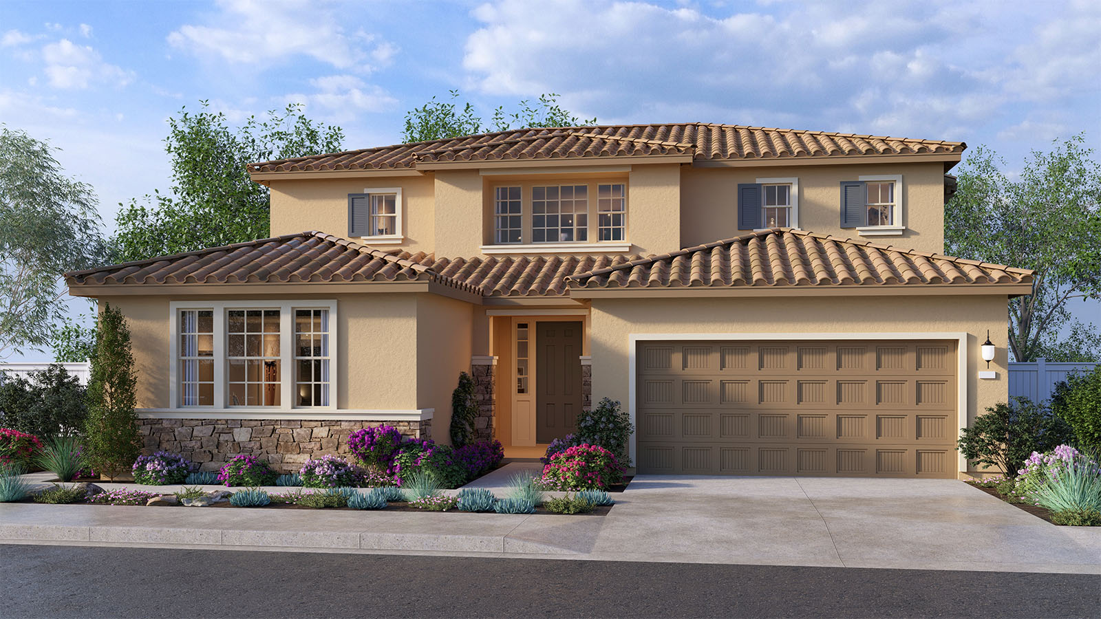 Two-story Tuscan home with stone veneer and two-car garage