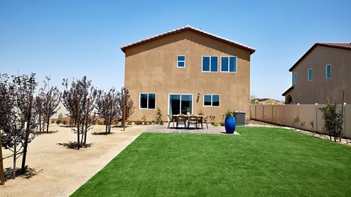 Spacious backyard with patio area and outdoor furniture