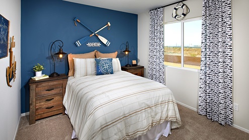 Fully furnished bedroom with plush carpet