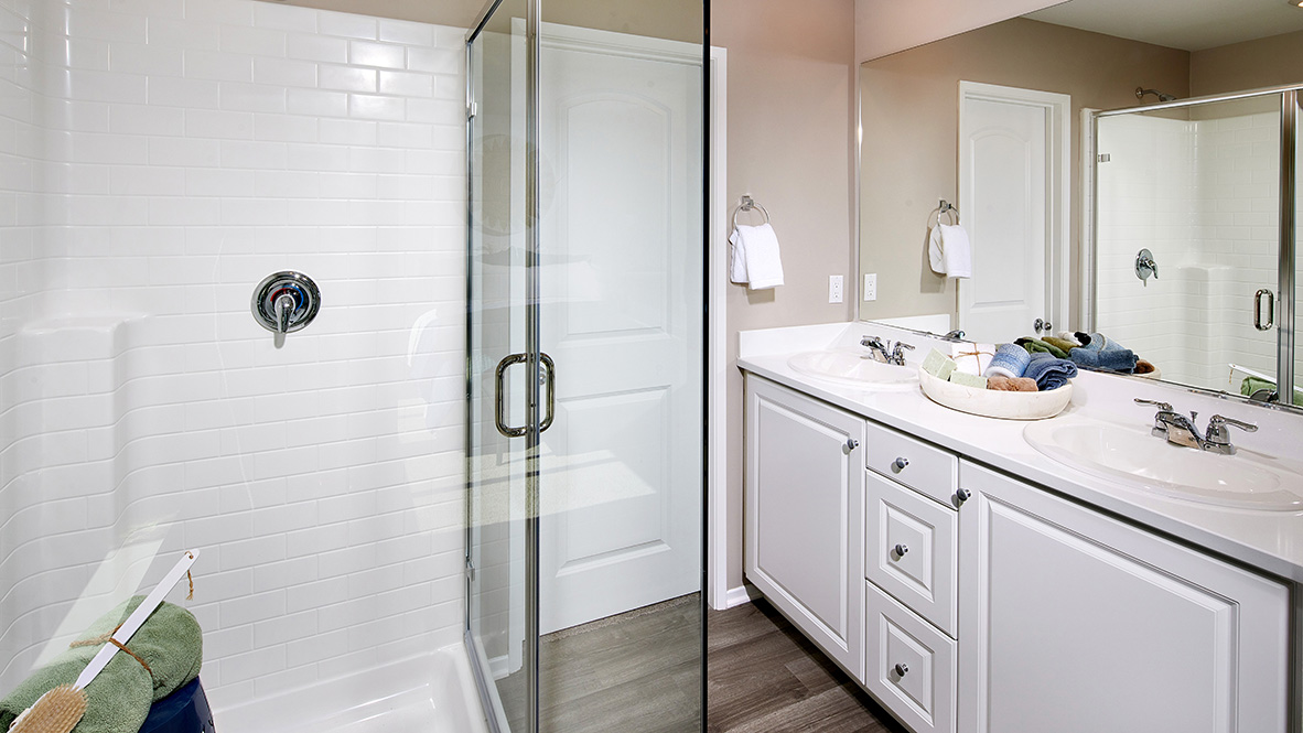 Primary bathroom with walk in shower and double sinks