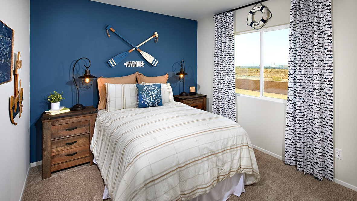 Fully furnished bedroom with plush carpet and full bed