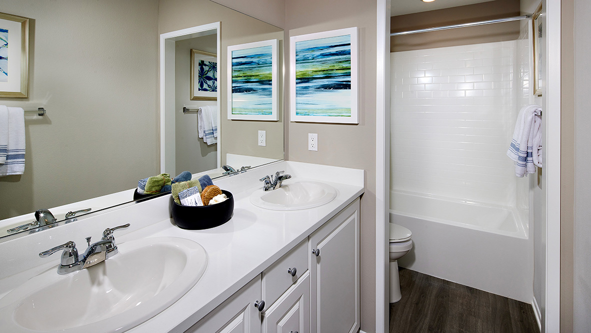 Bathroom with tub shower combination and double sinks