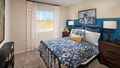 Fully furnished bedroom with full bed