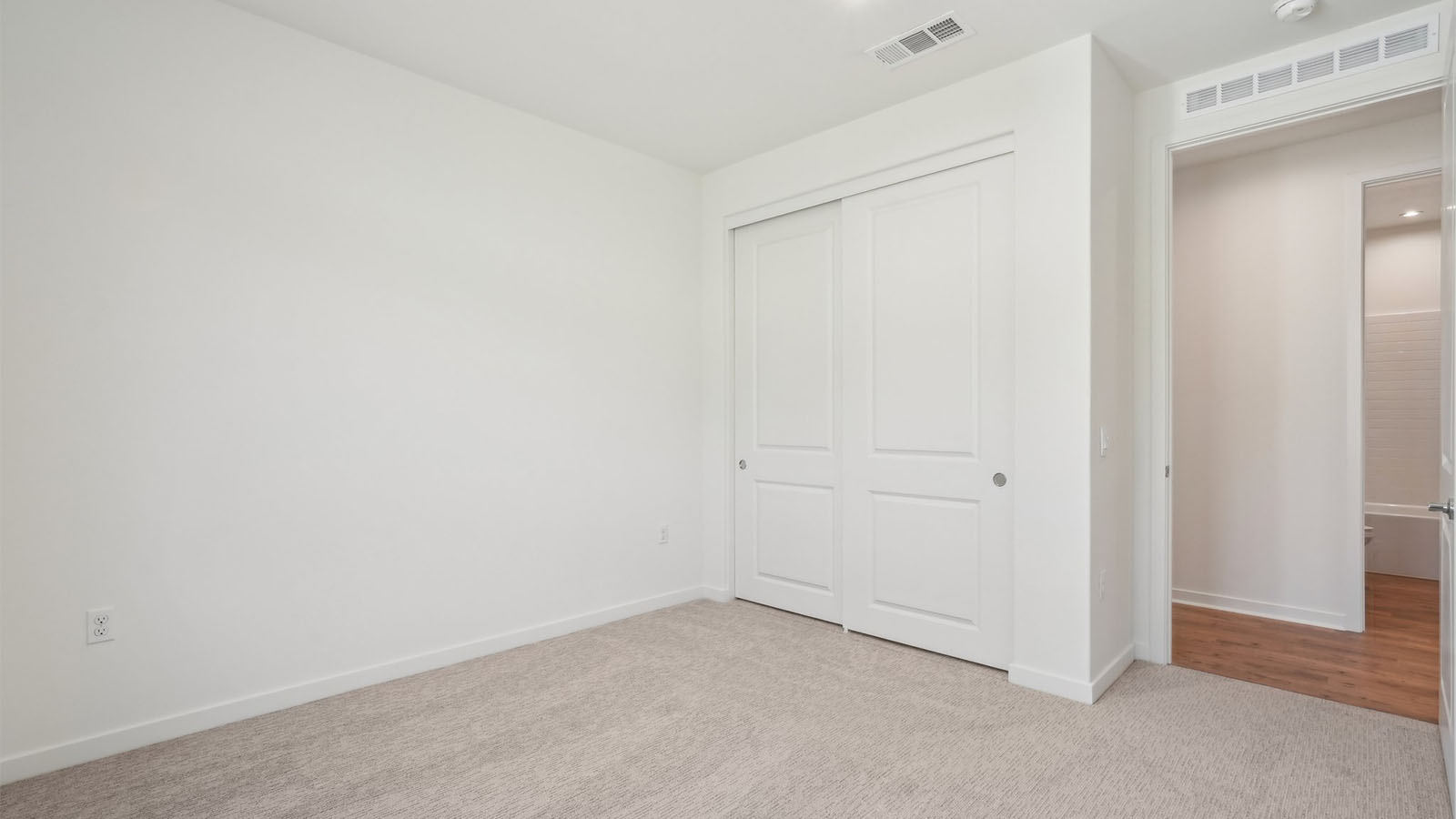 Secondary bedroom with carpet