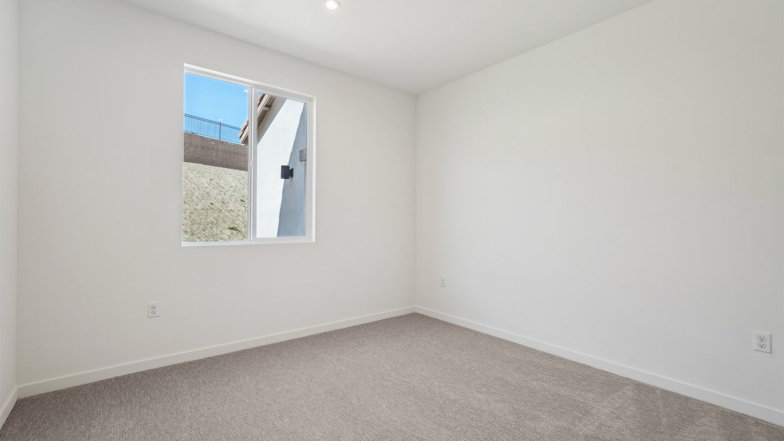 Secondary bedroom with carpet
