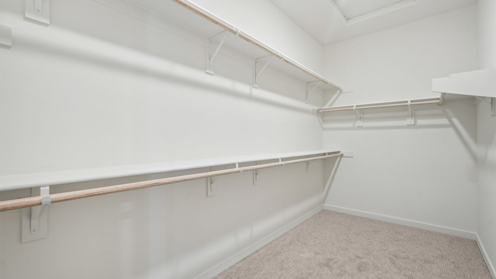 Primary bedroom walk-in closet