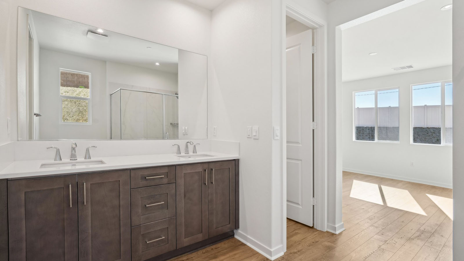 Primary bathroom with dual vanities