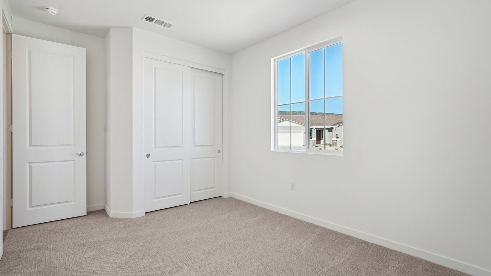 Secondary bedroom with carpet