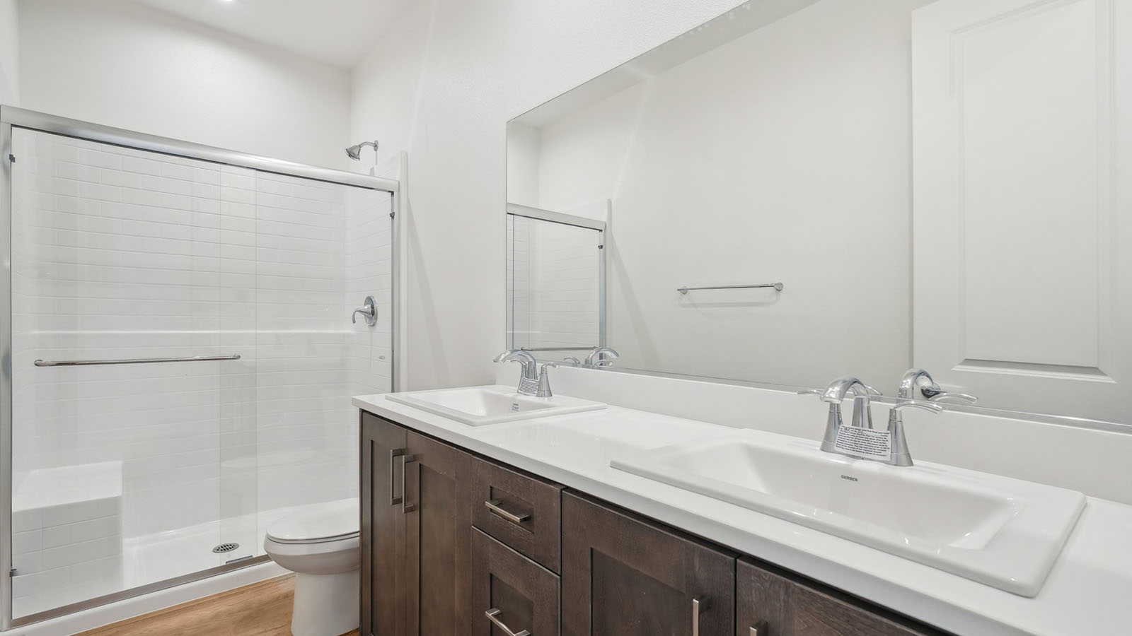 Secondary bathroom with vanity and shower