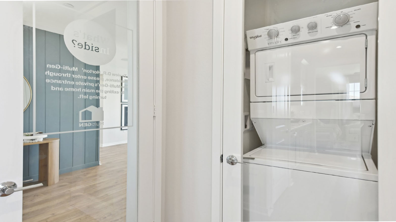 ulti-gen laundry area with stackable washer and dryer