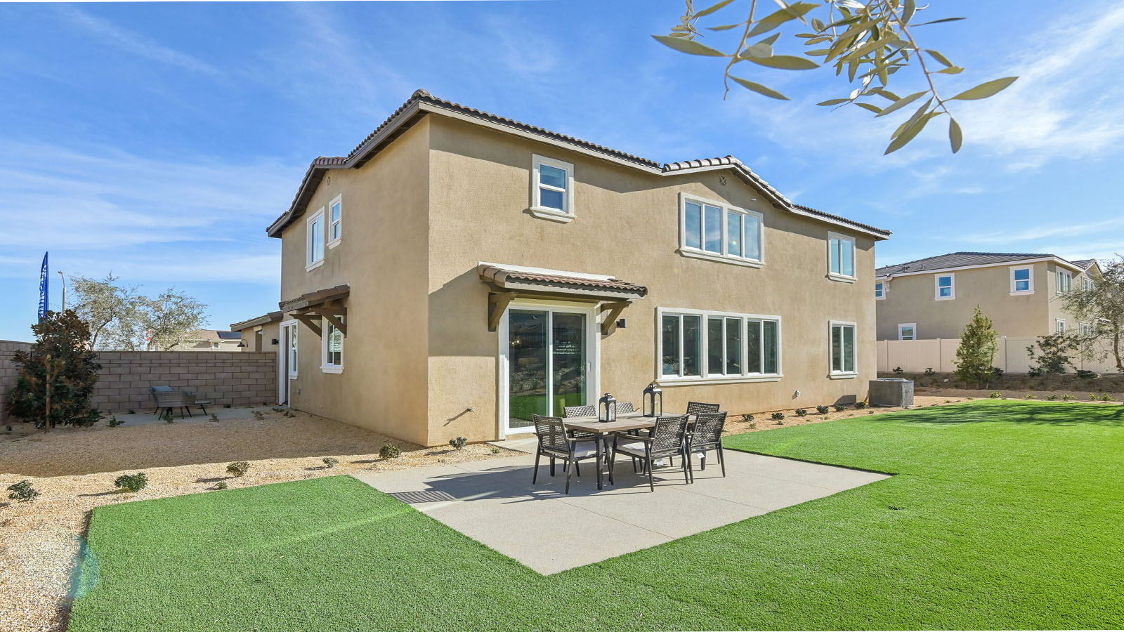 Spacious backyard with turf and patio area