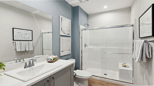Secondary bathroom with vanity and shower