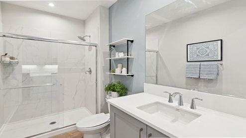 Secondary bathroom with vanity and shower
