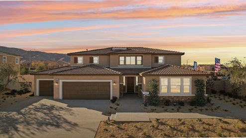 Two-story Tuscan home with stone veneer and three-car garage